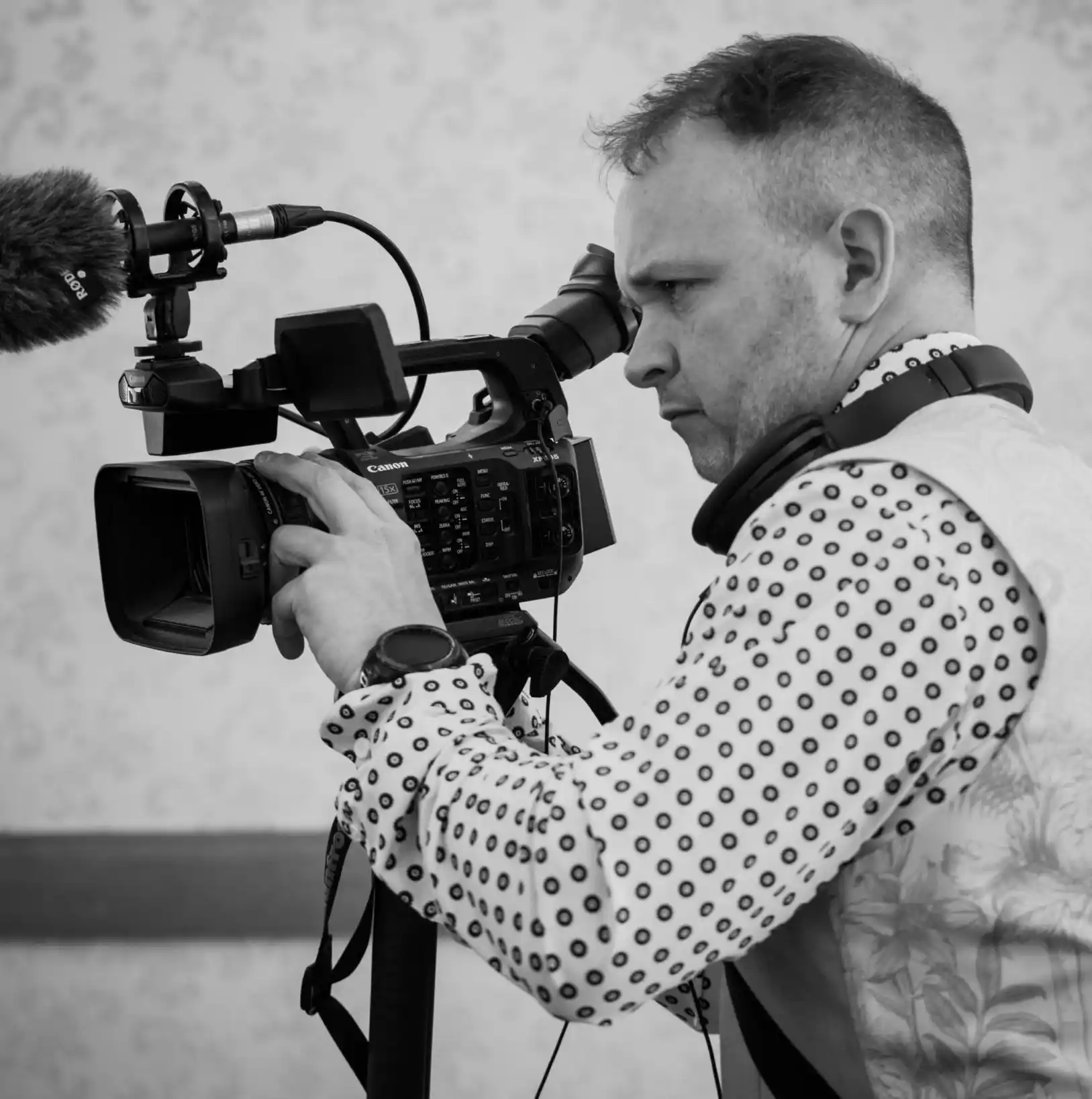 A photo of Ben Pope shooting a video